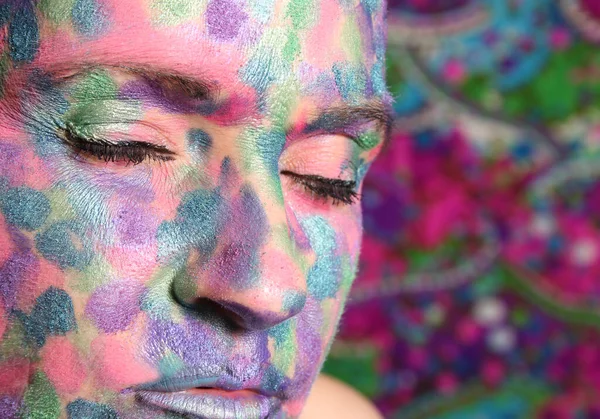 Woman With Colorful Make up Covering Face. Close up