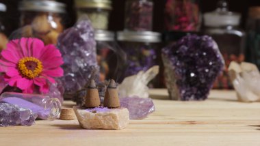 Amethyst Crystals With Flowers and Incense Cones on Meditation Altar