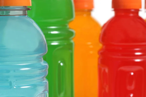 Bottles of Colorful Sports Drinks on White