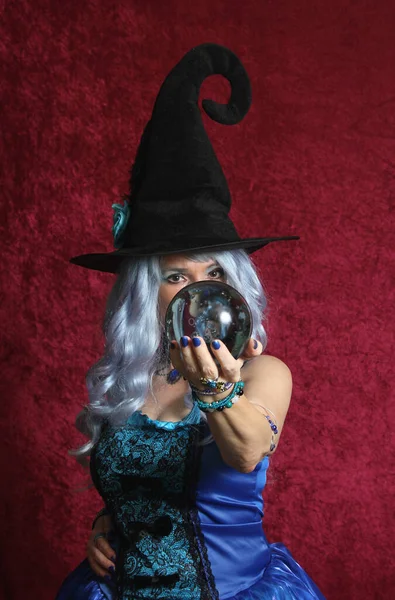 Woman Dressed Blue Witch Holding Crystal Ball Red Background — 스톡 사진