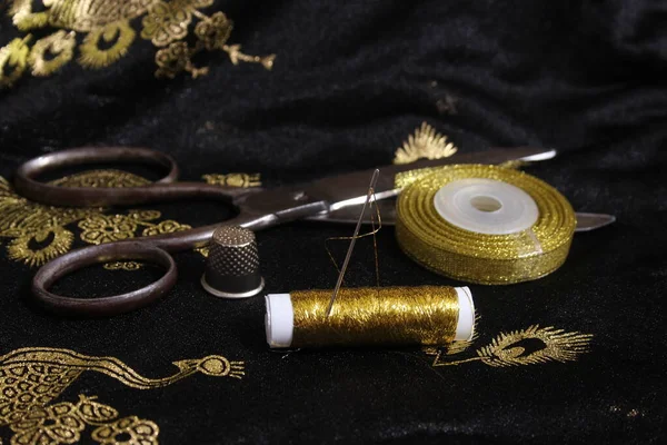 Spool Gold Thread Thimble Metallic Chiffon Fabric — стоковое фото