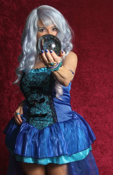 Woman Dressed Blue Witch Holding Crystal Ball Red Velvet — Stock Photo, Image