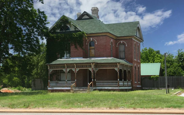 Historic Victorian Mansion Located in Rural East Texas With Blue Sky