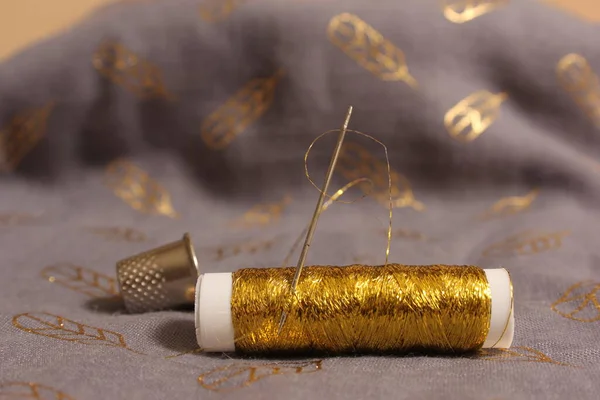 Spool Metallic Gold Thread Gray Gold Chiffon Fabric —  Fotos de Stock