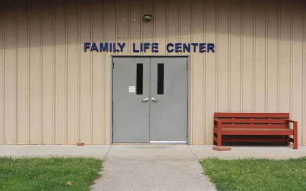 Metal Building With Family Life Center Sign above Door