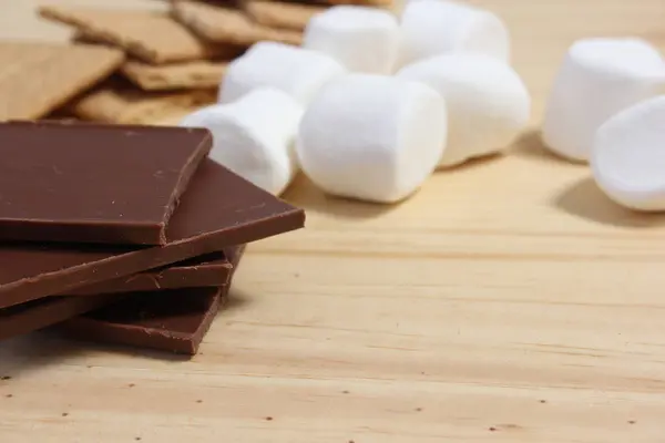 Smores. Marshmallow with Chocolate and Graham Crackers in Rustic Kitchen