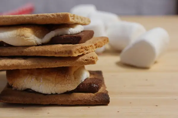 Smores. Marshmallow with Chocolate and Graham Crackers in Rustic Kitchen