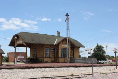 Bertram, TX - June 8, 2023: Historic Train Depot on Cloudy Day in Bertram TX clipart