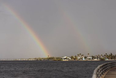 Natural Double Rainbow Over Water in Bradenton FL clipart