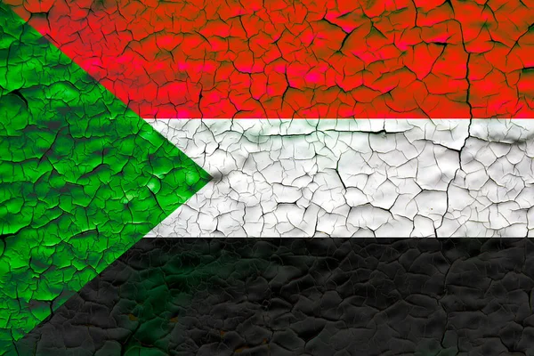 sudan flag painted over cracked concrete wall. sudan crisis concept illustration