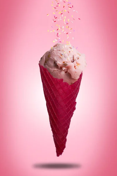 Ice cream cone ROSE ALMOND flavors on a pink background.