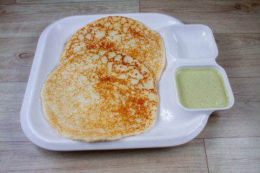 Soft & Spongy Malvani Amboli. It is a typical Konkani preparation made with rice and Urad dal or black lentil fermented batter. Soft Dosa or plain uttapam. Best to combine with fish curry. Copy Space clipart