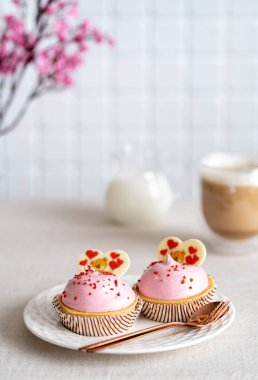 Delicious caramel Valentines Day Cupcakes With Heart Shape and raspberry taste. High quality photo