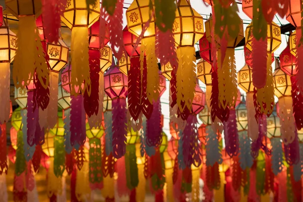 blur background Lantern Festival in Lamphun Province of Thailand is decorated with Lanna style paper lanterns during Loy Krathong Festival, worship of Lord Buddha in Buddhism using paper lanterns.