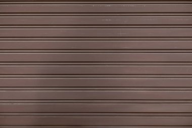 The background of the metal wall is painted brown to use as a shop wall and decorated with brown to make the space look charming and can also be used as an area for text space for advertising.