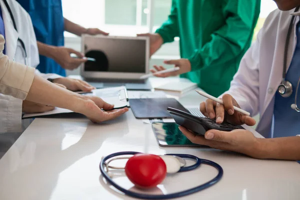 stock image concept of medical team meeting to discuss about treating heart disease with surgery and preventing recurrence of heart disease later. medical team meeting about cardiology to treat patients.