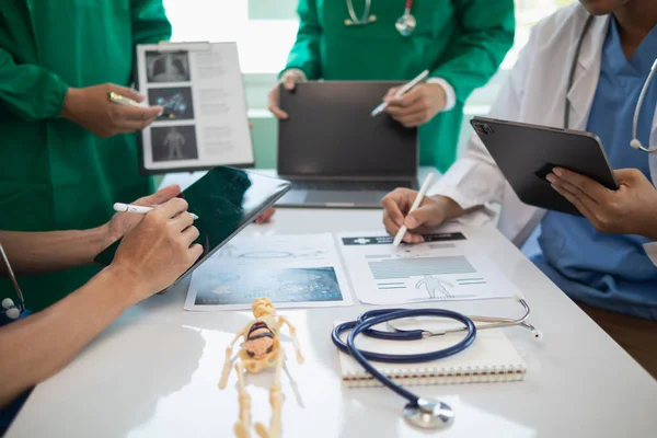 stock image concept of mobilizing ability of medical team in conference room to diagnose and treat disease correctly. medical team joins meeting and discusses  patient illness in order to treat it correctly