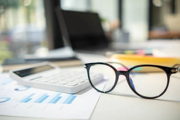 stock image eye glasses placed on the desk are eye glasses that are prepared for people with farsightedness to work and read documents clearly. The concept of wearing eye glasses for normal vision