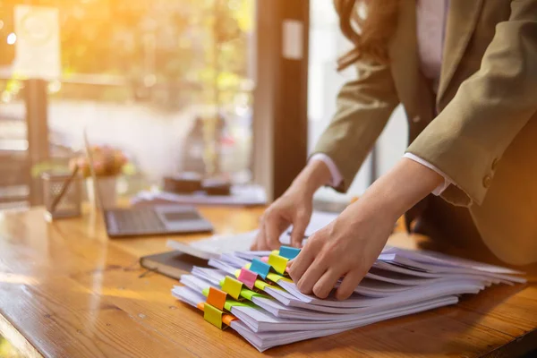 stock image stack of documents on secretary desk were prepared It is legal document for real estate buyers to be used as evidence of possession. stacked papers were placed on the table awaiting examination.