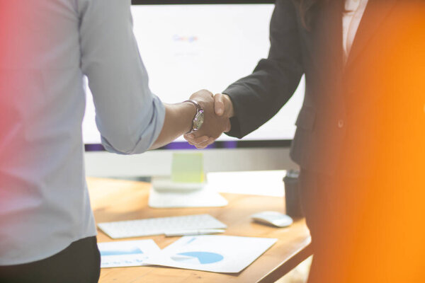 Businessmen and investors shake hands after attending  meeting with advisory team after receiving advice from  advisory team about jointly invested business. Businessmen Team handshake concept