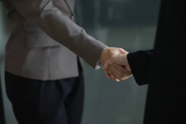 Businessmen and investors shake hands after attending  meeting with advisory team after receiving advice from  advisory team about jointly invested business. Businessmen Team handshake concept