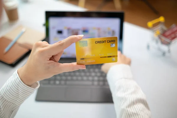 business woman is using credit card to pay for products online when ordering products from store through an online website because using credit card to pay for products brings convenience in shopping