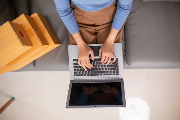 small SME entrepreneur has opened Home Office receive product orders and is checking product orders from online platforms order  deliver products according to orders.Home Office for business startups