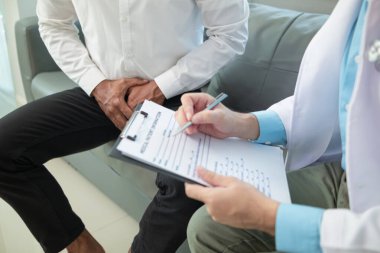 young man meets with doctor for checkup His sexual performance was impaired and doctors examined his symptoms and discovered that he had suspected tumor growing inside his penis Prostate cancer clipart
