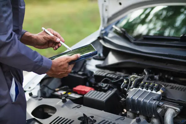 stock image car service center mechanics are checking condition car and engine make sure they are ready use and in perfect condition according center warranty. periodic vehicle inspections for safety in driving.