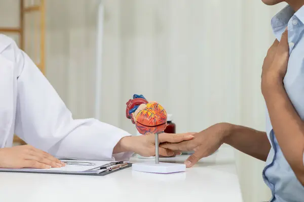 stock image A heart patient attended a hospital for a checkup with a doctor after experiencing chest pain. Doctors are advising patients to take care of their health after being diagnosed with heart disease.