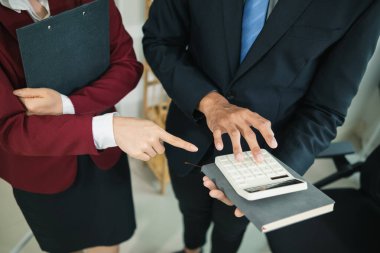 Blurred image,Business groups and investors are discussing investments and summarizing annual results in the meeting room. Ideas for advice and advice between investors to exchange knowledge clipart