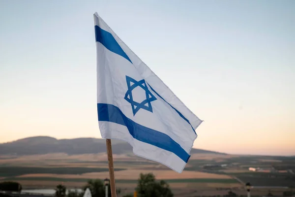日没時のイスラエル国旗 ロイヤリティフリーのストック写真