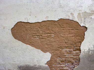 Faint traditional brick textured wall background in design loft style. Grunge reddish brown colored with copy space. Blank poster or wallpaper surface template. Partly damaged pattern.