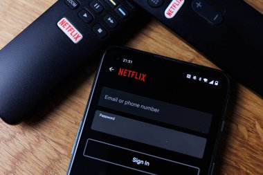 Kaunas, Lithuania - 2023 February 23: Netflix login on smartphone display. New password sharing rules on Netflix.