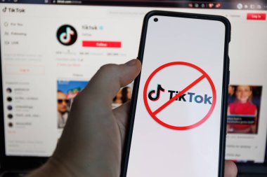 Kaunas, Lithuania - 2023, March 17: TikTok ban on smartphone. Tik tok app ban in various countries around globe. High quality photo clipart