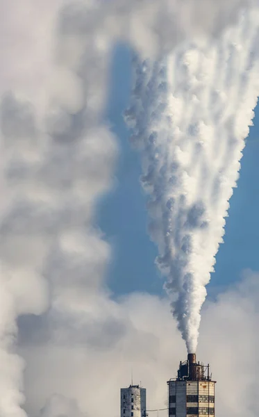 Massive industrial smoke from factory chimney. Global warming. Carbon dioxide pollution. High quality photo