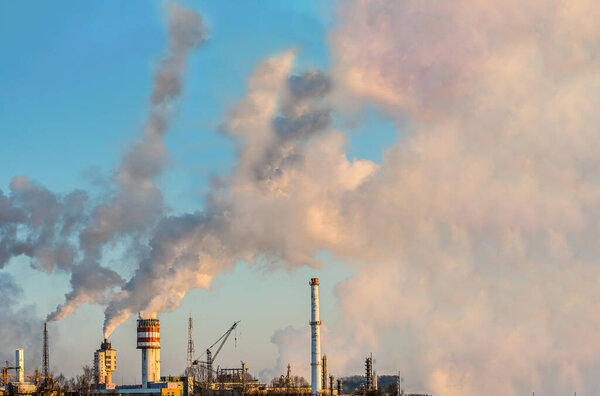 Massive industrial smoke from factory chimney. Global warming. Carbon dioxide pollution. High quality photo