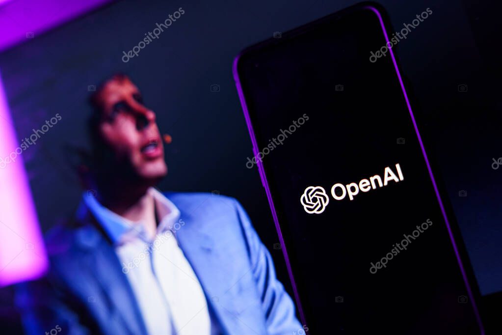 Kaunas, Lithuania - 2023 November 19: OpenAI logo and Sam Altman in background on screen. OpenAI fires CEO Sam Altman. High quality photo