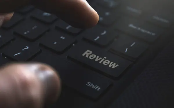 Review button on keyboard. Reviewing online services. High quality photo