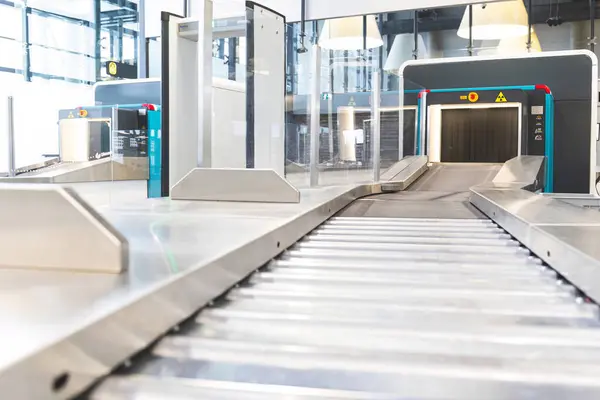 Security baggage scanners and gates with metal detectors at airport. High quality photo