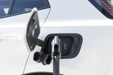 Electric car in EV charging station. concept of green energy and eco power produced from sustainable source to supply to charger station to reduce CO2 emission. High quality photo