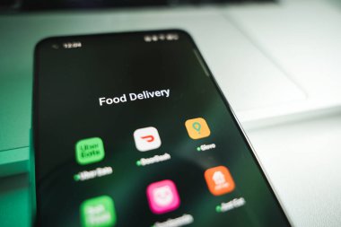 Kaunas, Lithuania - 2024 October 28: Food delivery apps on phone screen. Food delivery to home concept. High quality photo clipart