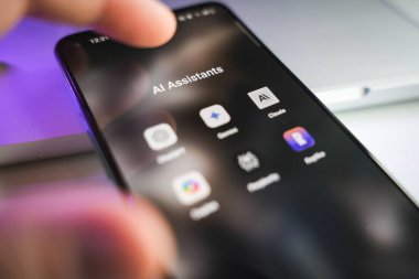 Kaunas, Lithuania - 2024 October 29: AI chatbots and assistants apps on smartphone screen. ChatGPT, Gemini, Clause, Copilot. High quality photo clipart