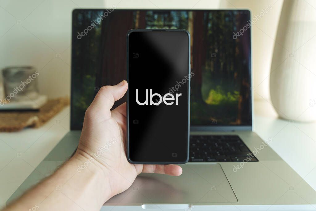 Uber application logo in front of laptop. High quality photo. Kaunas Lithuania - 2024 October 31