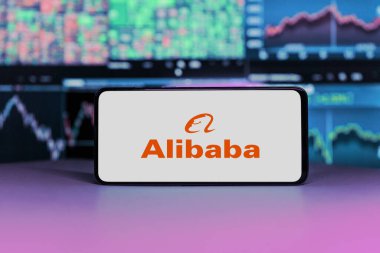 Alibaba logo on mobile phone screen. company shares rise or fall on stock exchange market : London, United Kingdom - 2024 November 6 clipart