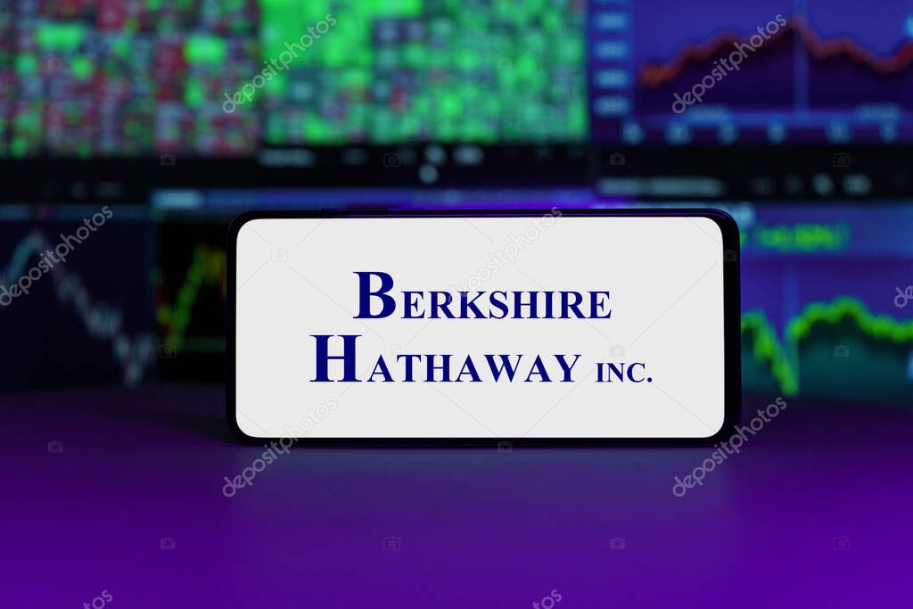 Berkshire Hathaway logo on mobile phone screen company shares rise or fall on stock exchange market: London, United Kingdom - 2024 November 6