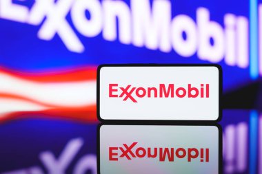 Exxonmobil corporation logo displayed on the screen. Kaunas, Lithuania - 2024 November 23 clipart