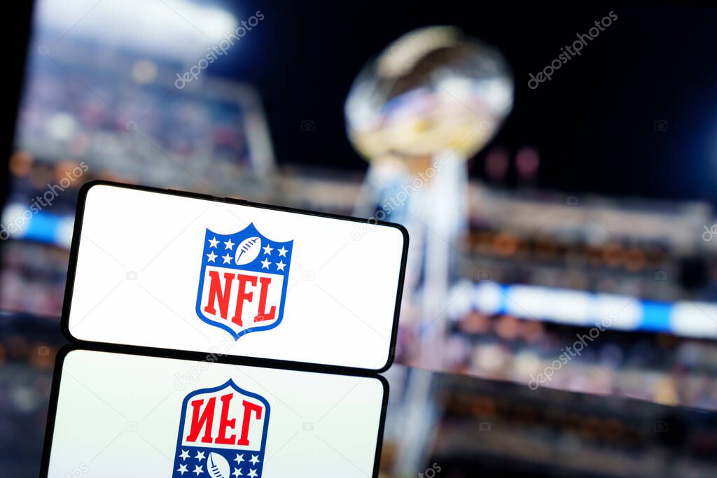 A smartphone displaying the NFL logo with a blurred Super bowl background. January 13, 2025