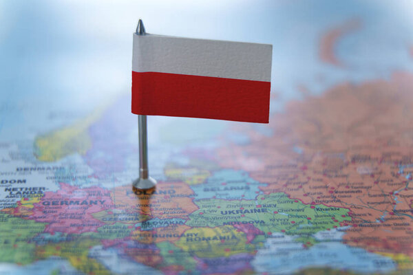 Poland map with a pin showing the national flag. Close-up view. Travel, geography, and politics concept. High quality photo