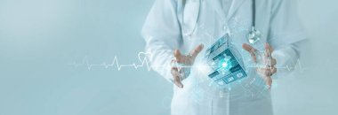 Doctor hold medical services block cube with innovative healthcare business network. Intelligent medical technology develop health insurance and medical business service to protect people life.